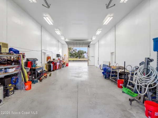 a spacious bathroom with a tub sink and mirror