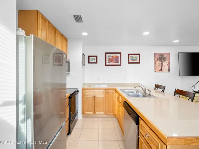 a spacious bathroom with a tub sink and mirror