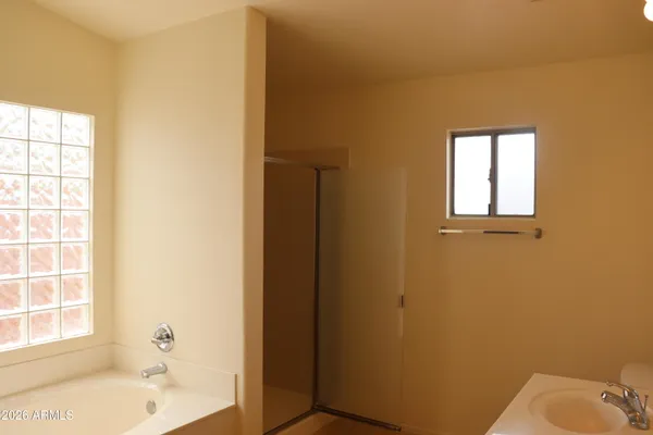 a bathroom with a toilet and shower