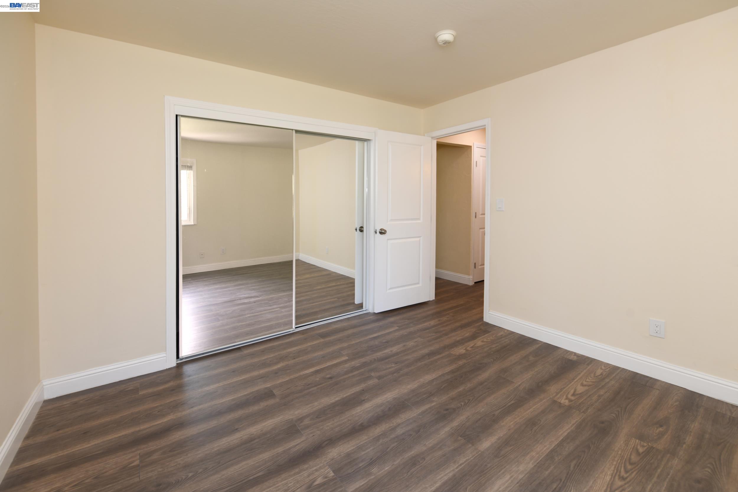205 Muir Road Martinez, CA 94553 - Photo 12 of 20 a view of wooden floor in an empty room