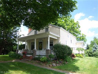 Front of house from driveway side, East.