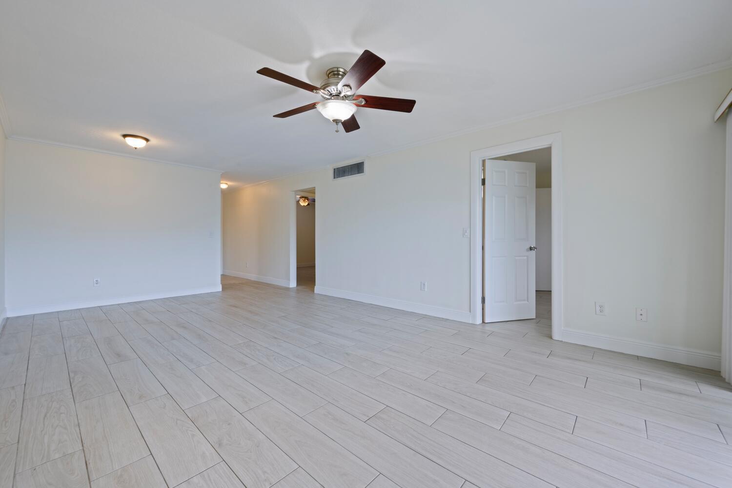 1505 Crescent Circle, Unit A8 Lake Park, FL 33403 - Photo 6 of 32 a view of empty room with wooden floor