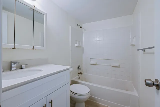 a bathroom with a sink a toilet and a bathtub