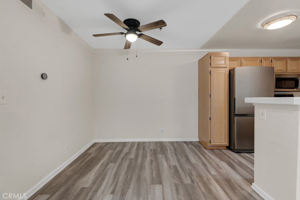 5744 Oak Bend Lane, Unit 203 Oak Park, CA 91377 - Photo 12 of 45 wooden floor in an empty room with a window