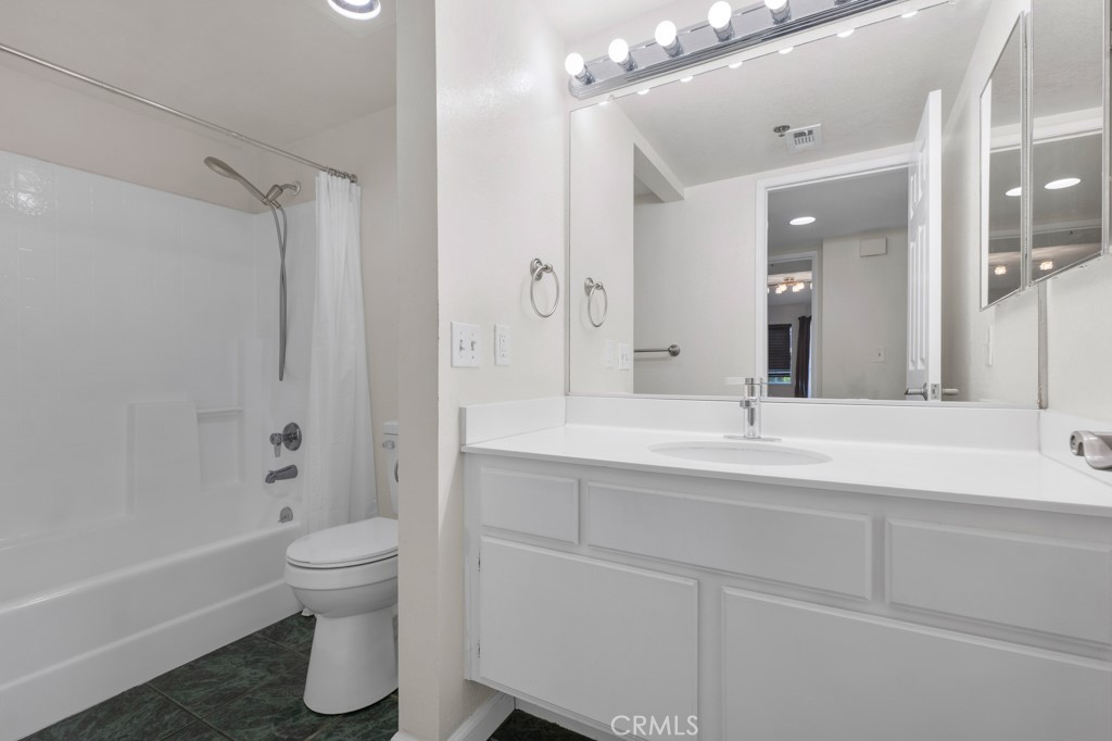 5744 Oak Bend Lane, Unit 203 Oak Park, CA 91377 - Photo 2 of 45 a bathroom with a sink a toilet and shower