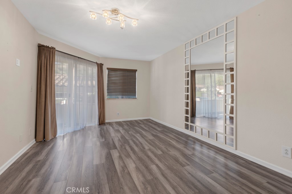 5744 Oak Bend Lane, Unit 203 Oak Park, CA 91377 - Photo 5 of 45 wooden floor in an empty room with a window