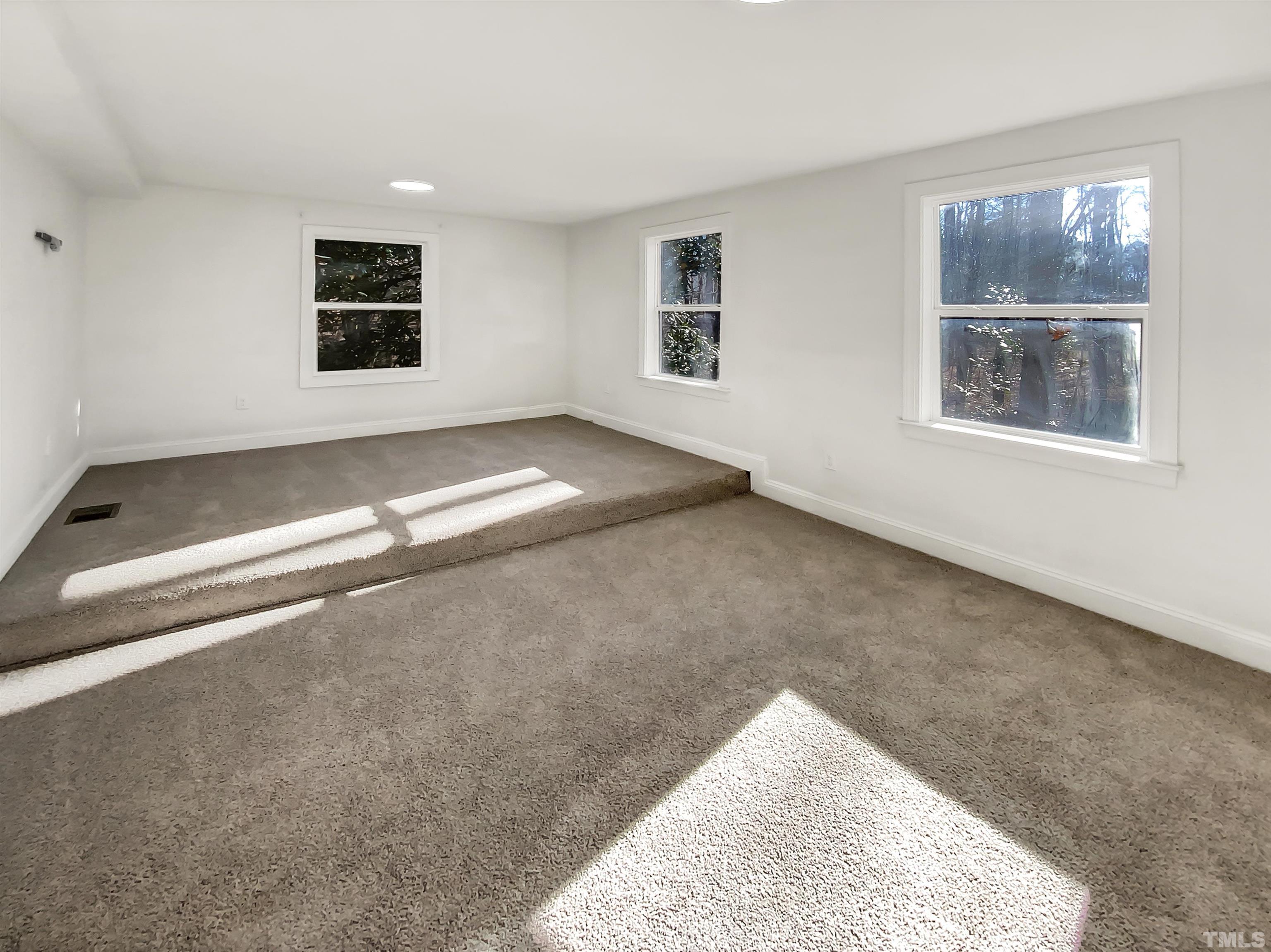1007 Castalia Drive Cary, NC 27513 - Photo 13 of 17 a view of empty room with windows