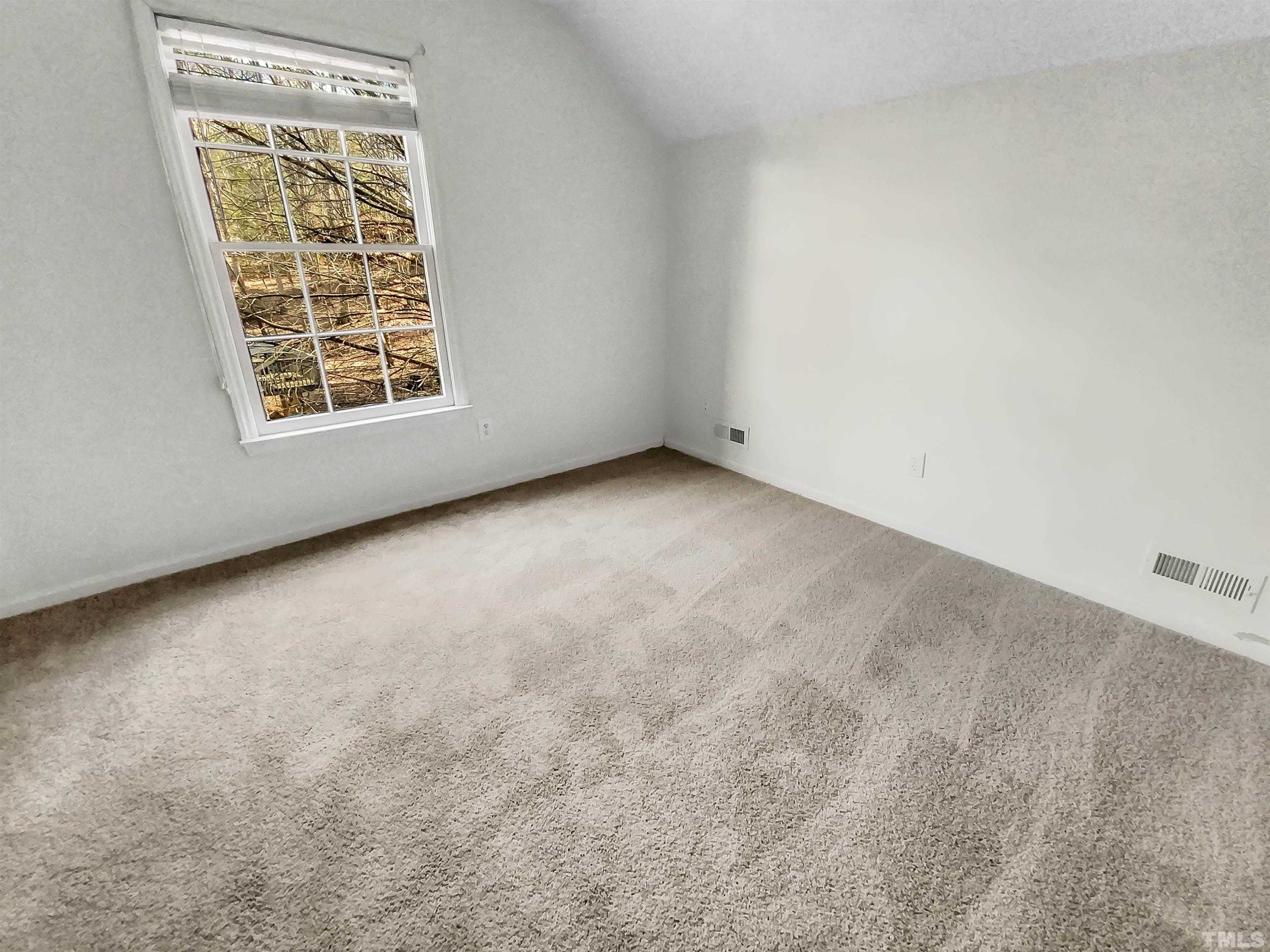 1007 Castalia Drive Cary, NC 27513 - Photo 15 of 17 an empty room with windows