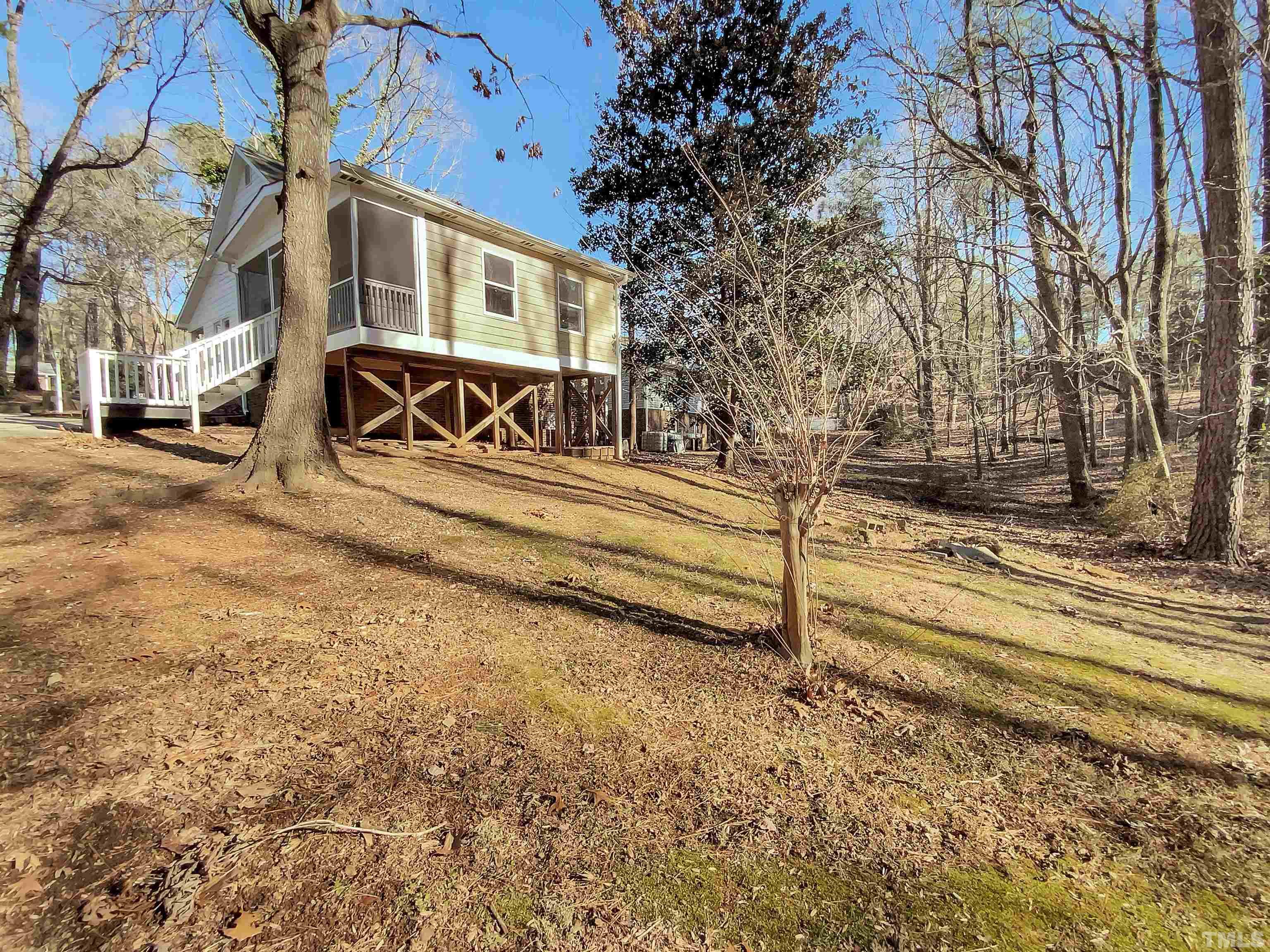 1007 Castalia Drive Cary, NC 27513 - Photo 17 of 17 a view of a house with a yard covered in snow
