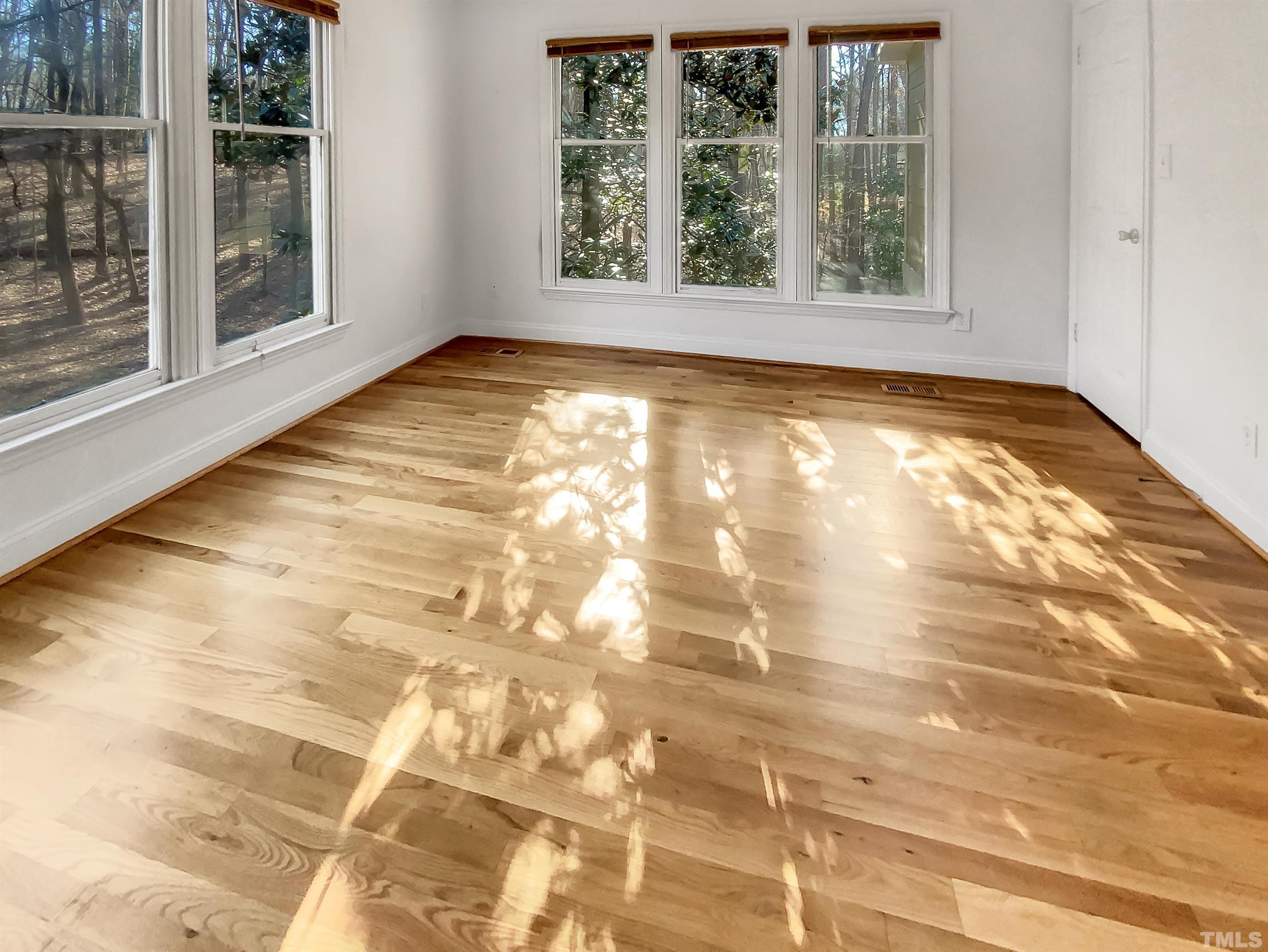 1007 Castalia Drive Cary, NC 27513 - Photo 5 of 17 a view of an empty room with a window