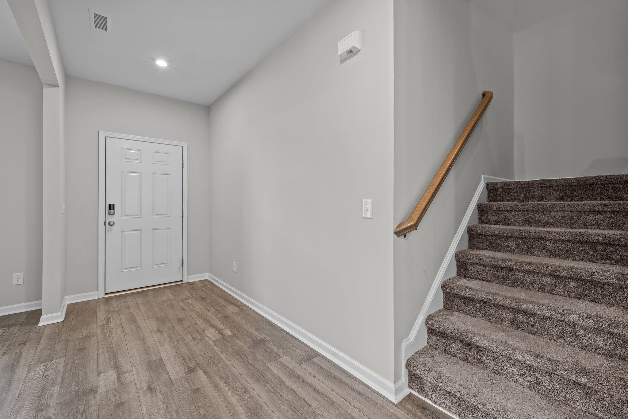 91 Stromness Path Clayton, NC 27527 - Photo 13 of 48 a view of entryway with stairs
