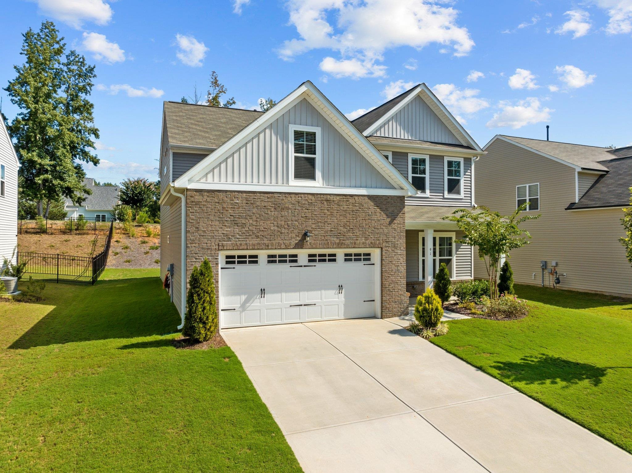 91 Stromness Path Clayton, NC 27527 - Photo 2 of 48 a front view of house with yard and green space