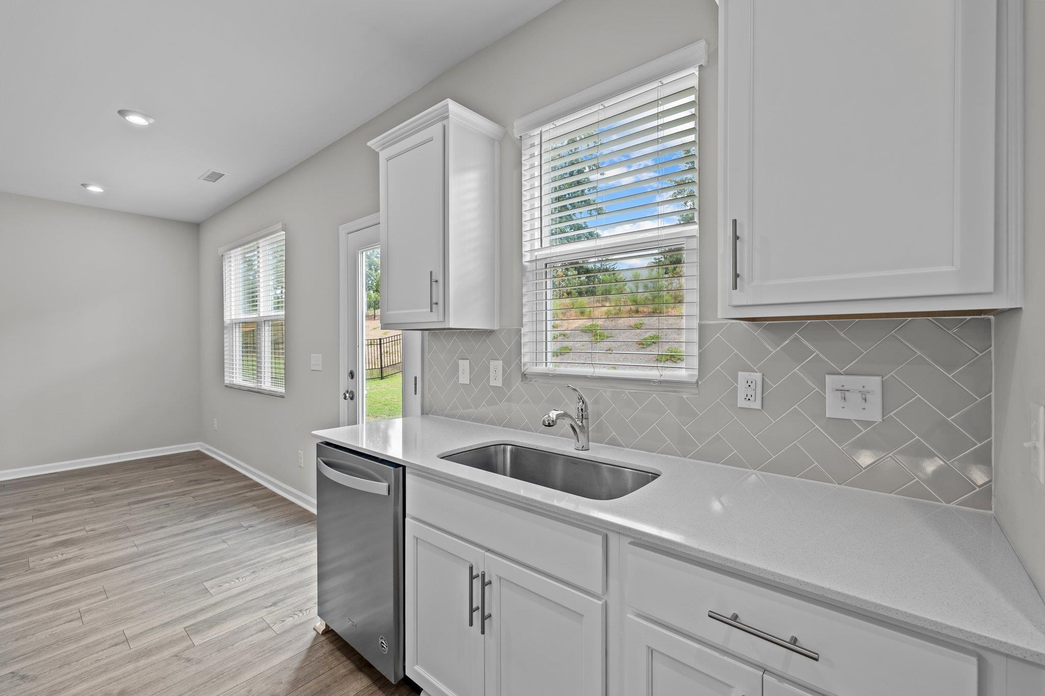 91 Stromness Path Clayton, NC 27527 - Photo 22 of 48 a kitchen with sink and cabinets