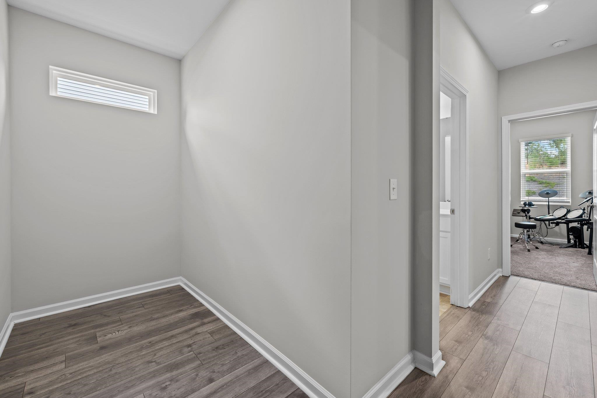 91 Stromness Path Clayton, NC 27527 - Photo 26 of 48 a view of a livingroom from a hallway