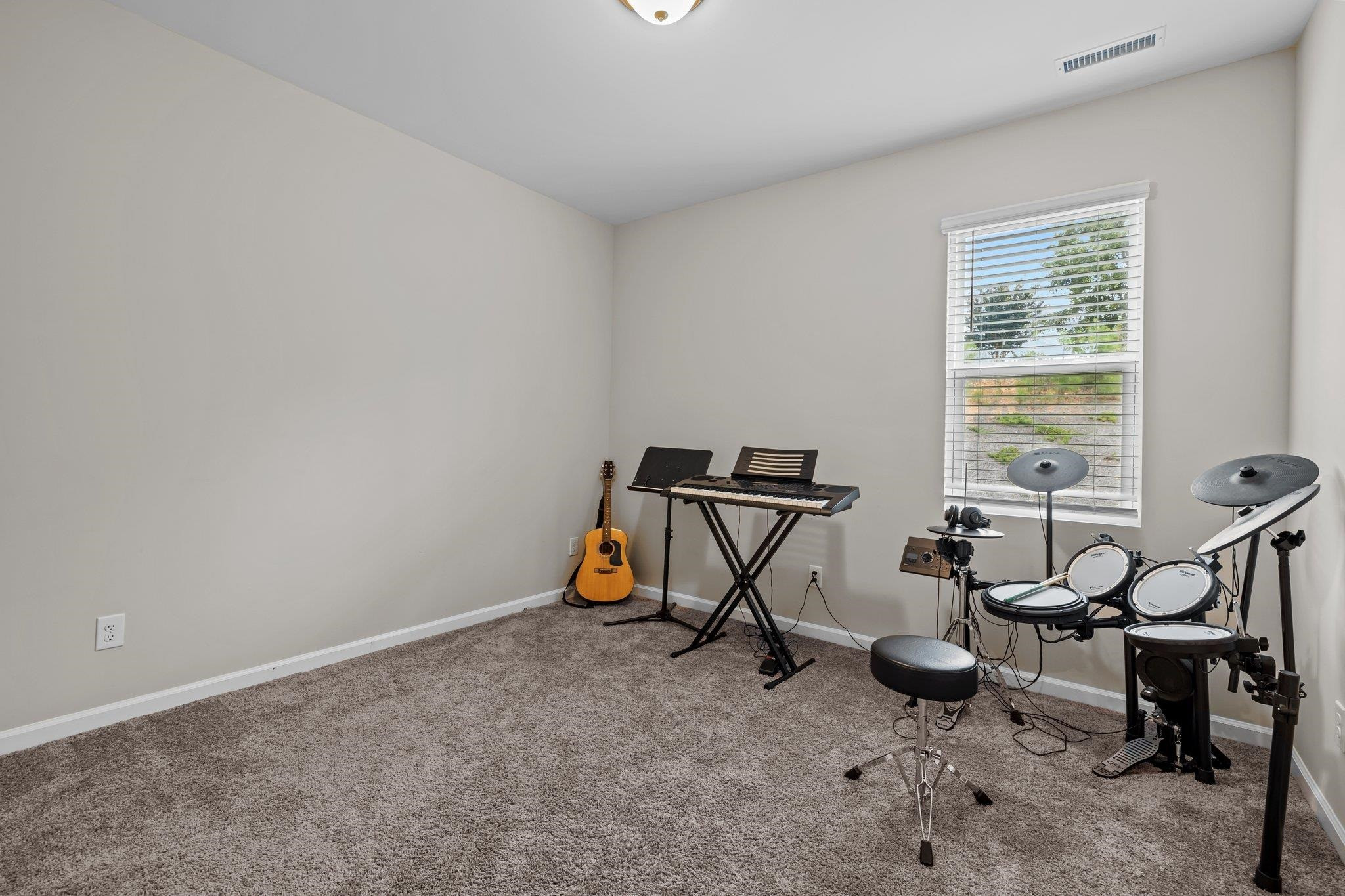 91 Stromness Path Clayton, NC 27527 - Photo 27 of 48 a view of a room with gym equipment