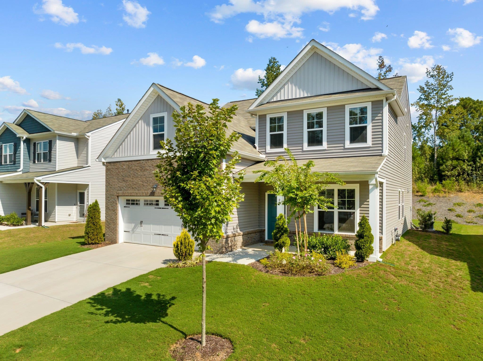 91 Stromness Path Clayton, NC 27527 - Photo 3 of 48 a front view of a house with garden