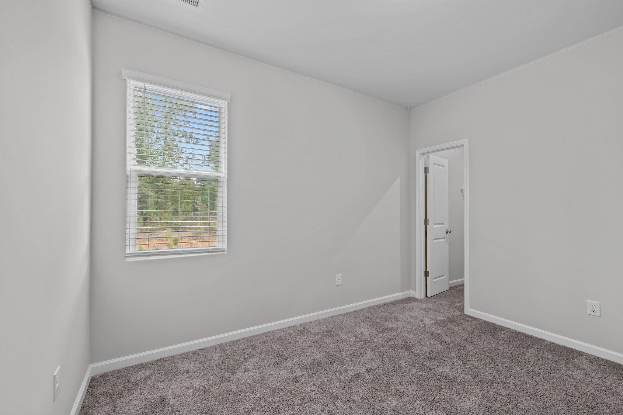 91 Stromness Path Clayton, NC 27527 - Photo 33 of 48 a view of an empty room with a window