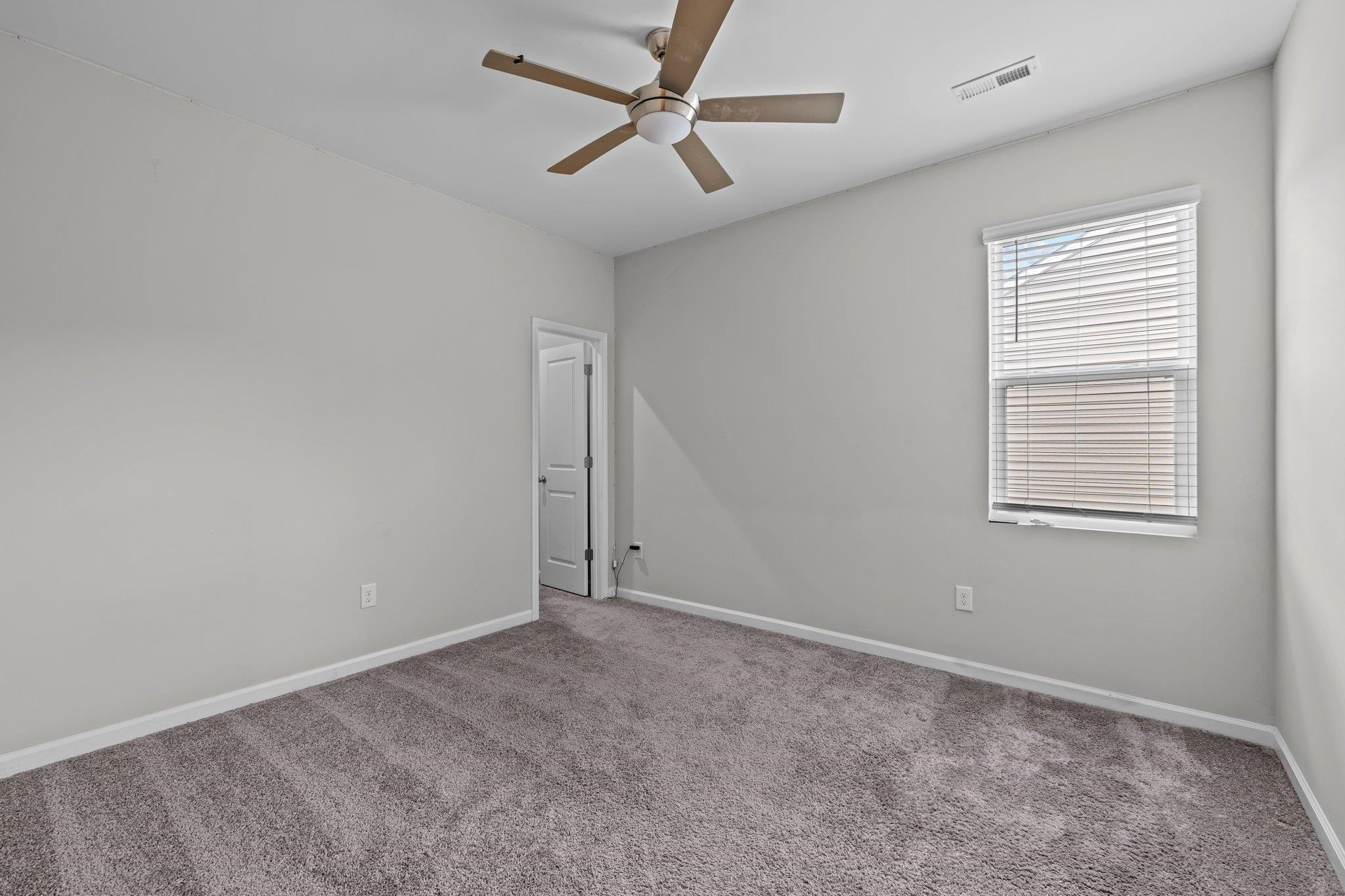 91 Stromness Path Clayton, NC 27527 - Photo 34 of 48 a view of an empty room with a window