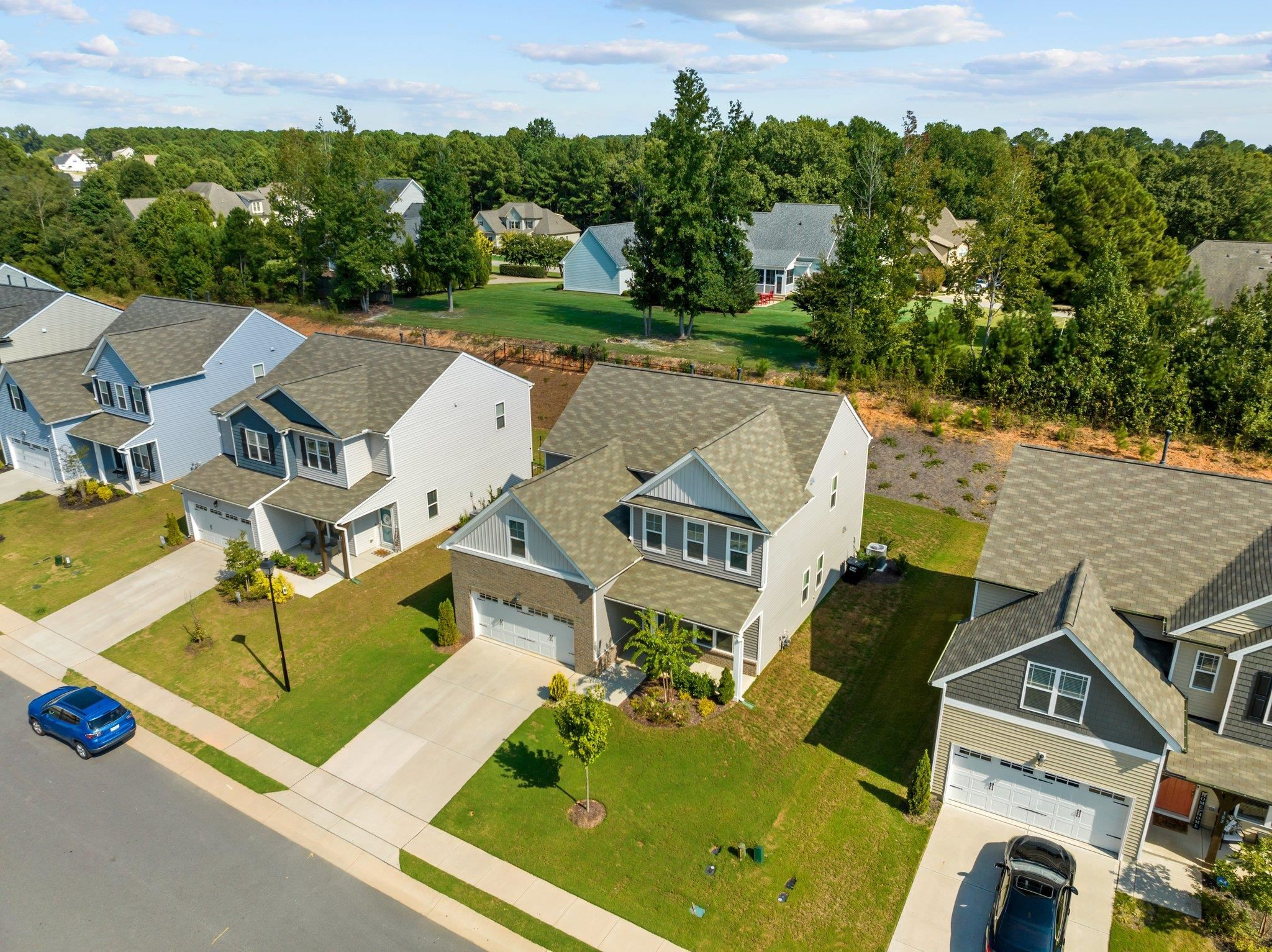 91 Stromness Path Clayton, NC 27527 - Photo 5 of 48 an aerial view of a house with outdoor space and lake view