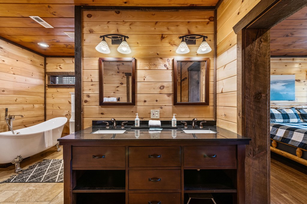 31 Hope Drive Blue Ridge, GA 30513 - Photo 52 of 80 a bathroom with a sink and a large mirror