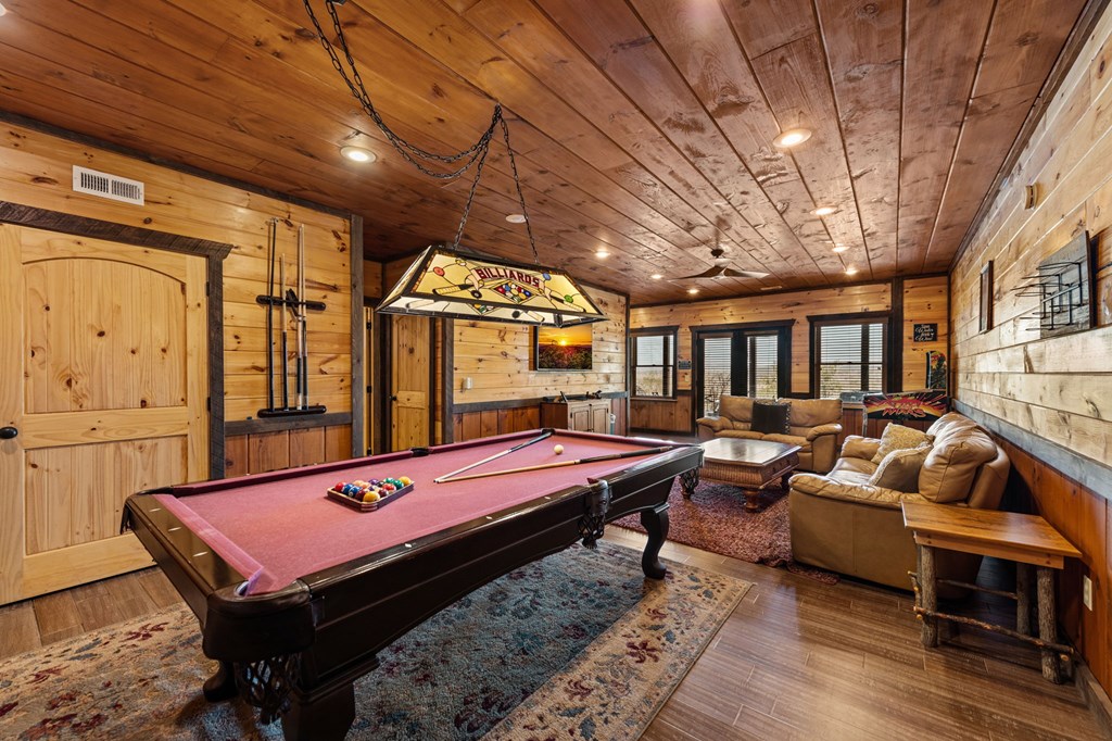 31 Hope Drive Blue Ridge, GA 30513 - Photo 59 of 80 a room with furniture pool table wooden floor and windows