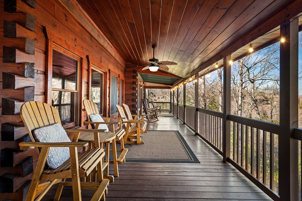 31 Hope Drive Blue Ridge, GA 30513 - Photo 65 of 80 a view of a patio with table and chairs with wooden floor and fence