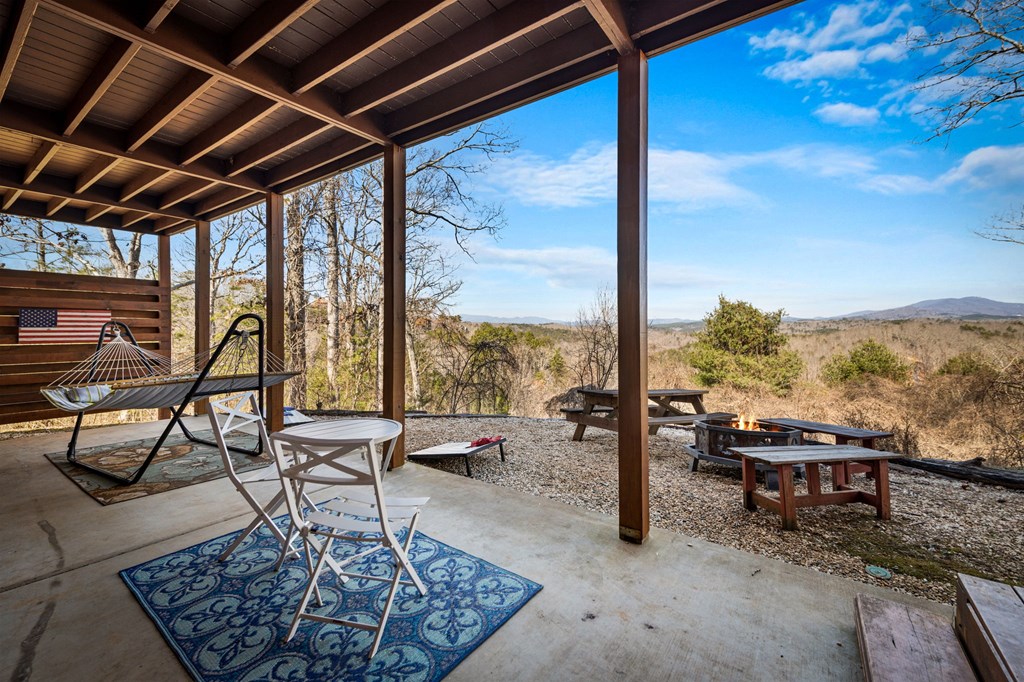 31 Hope Drive Blue Ridge, GA 30513 - Photo 67 of 80 a living room with patio furniture and a floor to ceiling window