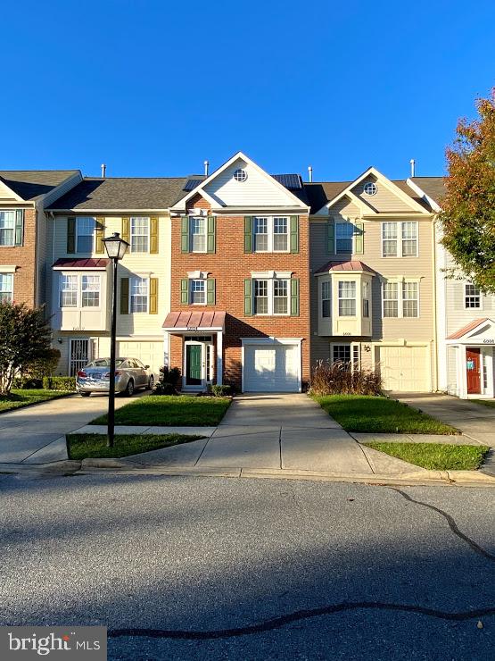 6004 Cedar Post Drive District Heights, MD 20747 - Photo 2 of 28 a front view of a house with a garden