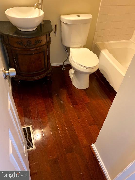 6004 Cedar Post Drive District Heights, MD 20747 - Photo 13 of 28 a bathroom with a toilet and a sink