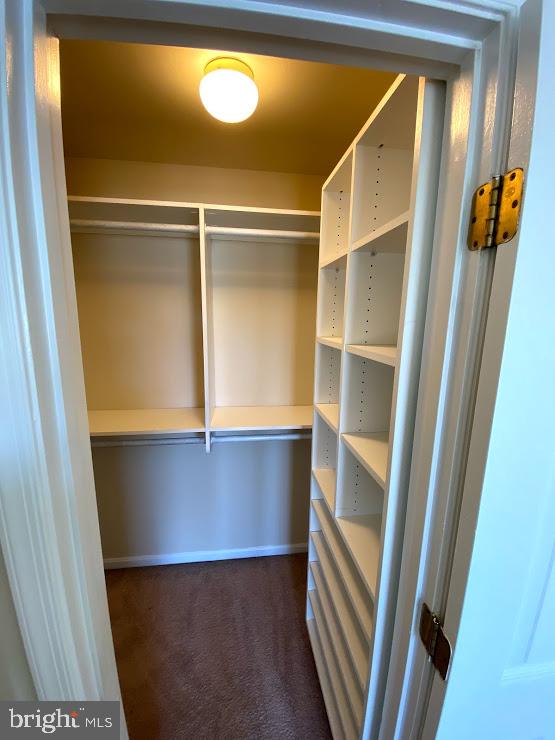 6004 Cedar Post Drive District Heights, MD 20747 - Photo 19 of 28 a view of an empty room with wooden floor and a window