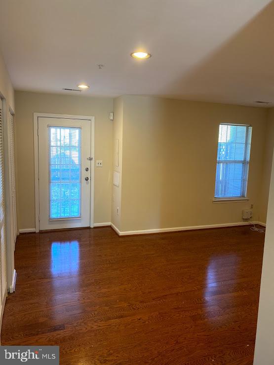 6004 Cedar Post Drive District Heights, MD 20747 - Photo 20 of 28 a view of an empty room with window and wooden floor