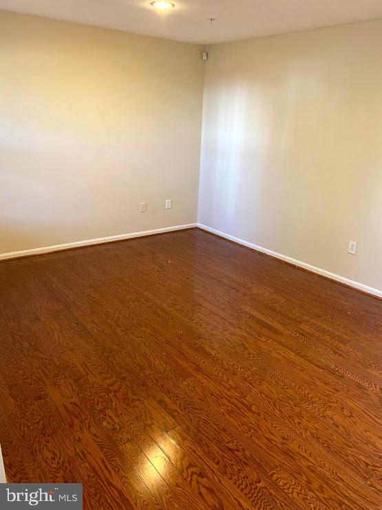 6004 Cedar Post Drive District Heights, MD 20747 - Photo 21 of 28 en empty room with wooden floor