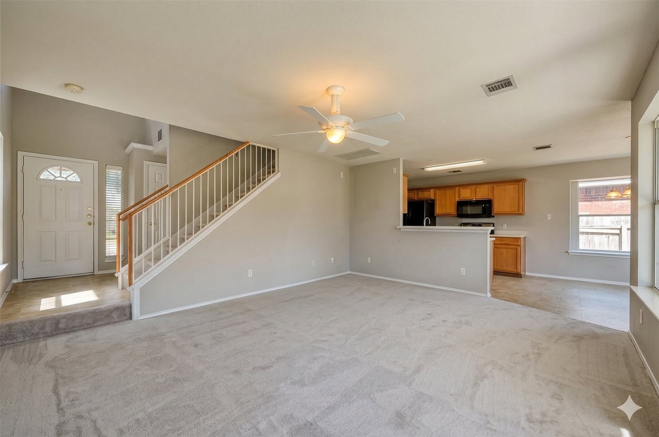 15543 Miss Adrienne's Path Pflugerville, TX 78660 - Photo 2 of 9 a view of a livingroom with a staircase