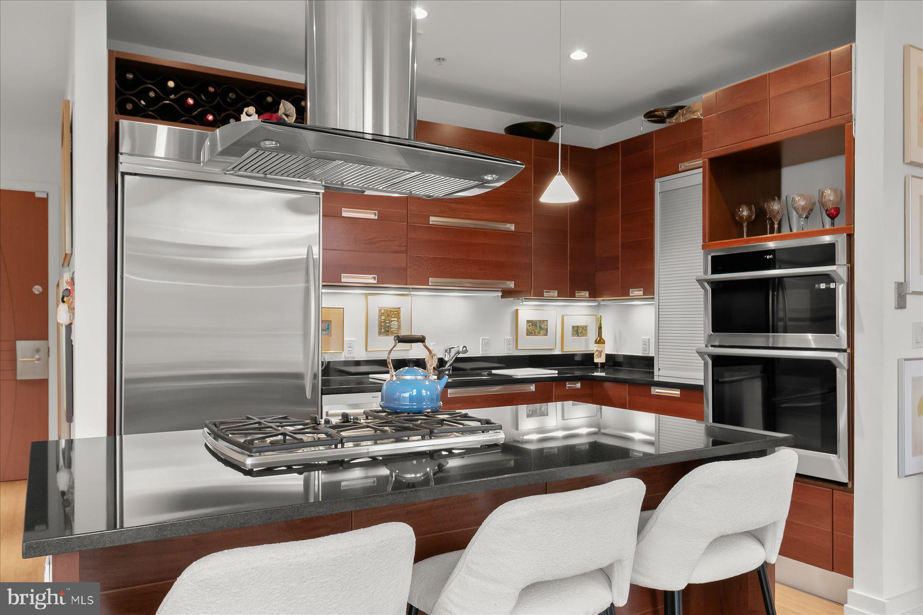 1413 P Street Northwest, Unit 301 Washington, DC 20005 - Photo 12 of 25 Large Center Island & Stainless Steel Appliances