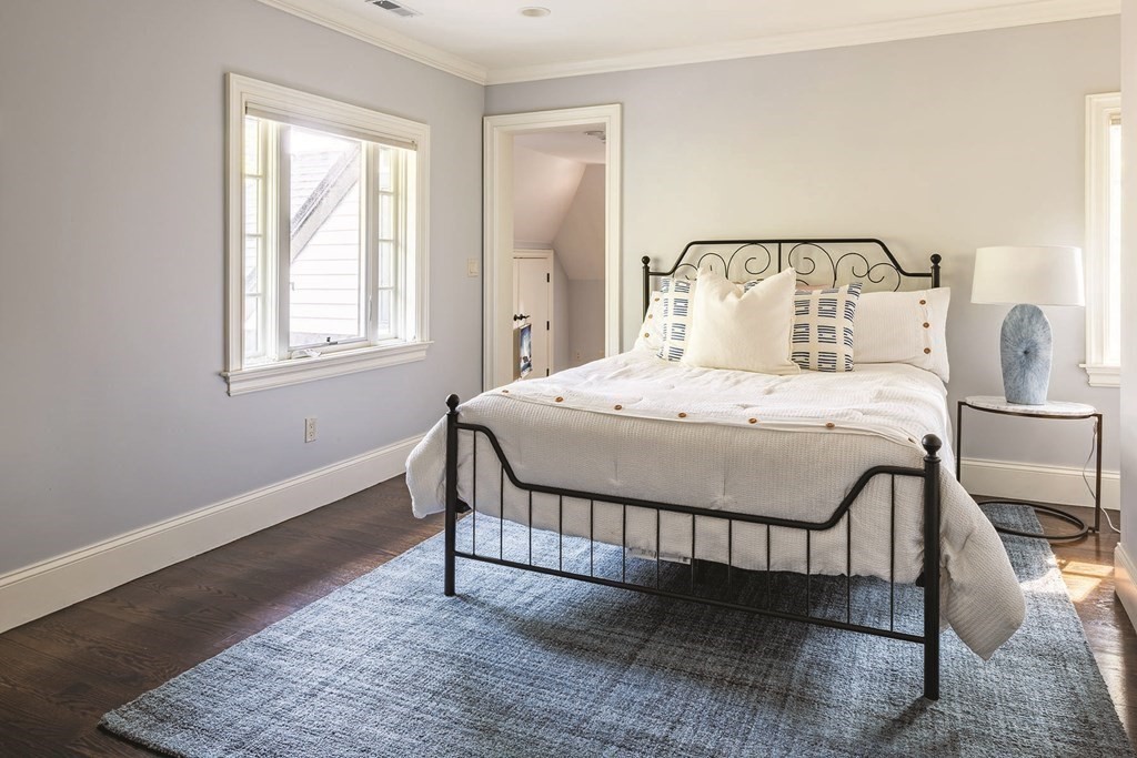 132 Hammond Street Newton, MA 02467 - Photo 12 of 17 a bedroom with a bed and wooden floor