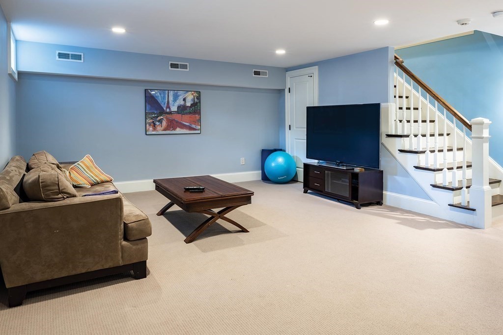 132 Hammond Street Newton, MA 02467 - Photo 16 of 17 a living room with furniture and a flat screen tv