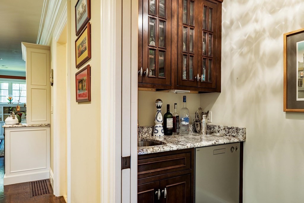 132 Hammond Street Newton, MA 02467 - Photo 7 of 17 a bathroom with a granite countertop sink and a mirror