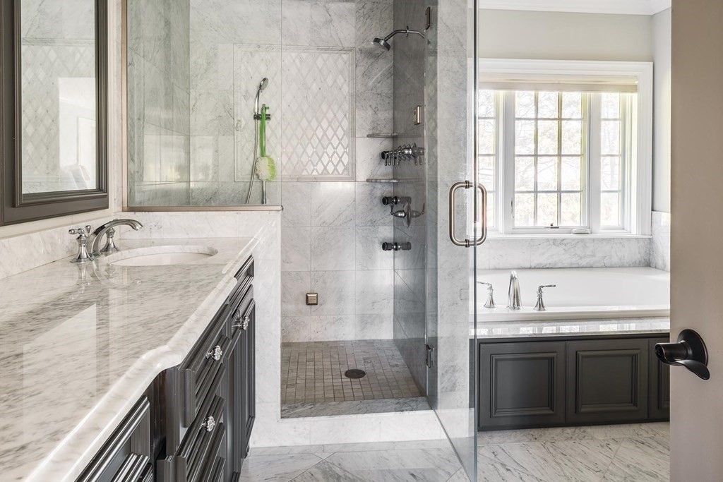 132 Hammond Street Newton, MA 02467 - Photo 10 of 17 a spacious bathroom with a granite countertop tub sink and mirror