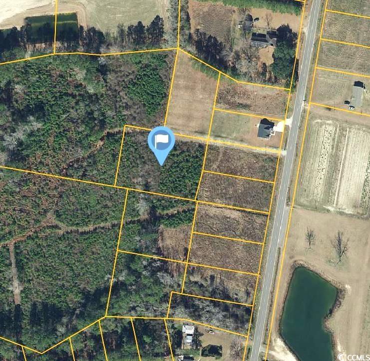 Aerial view of property's location featuring property parcel outlined