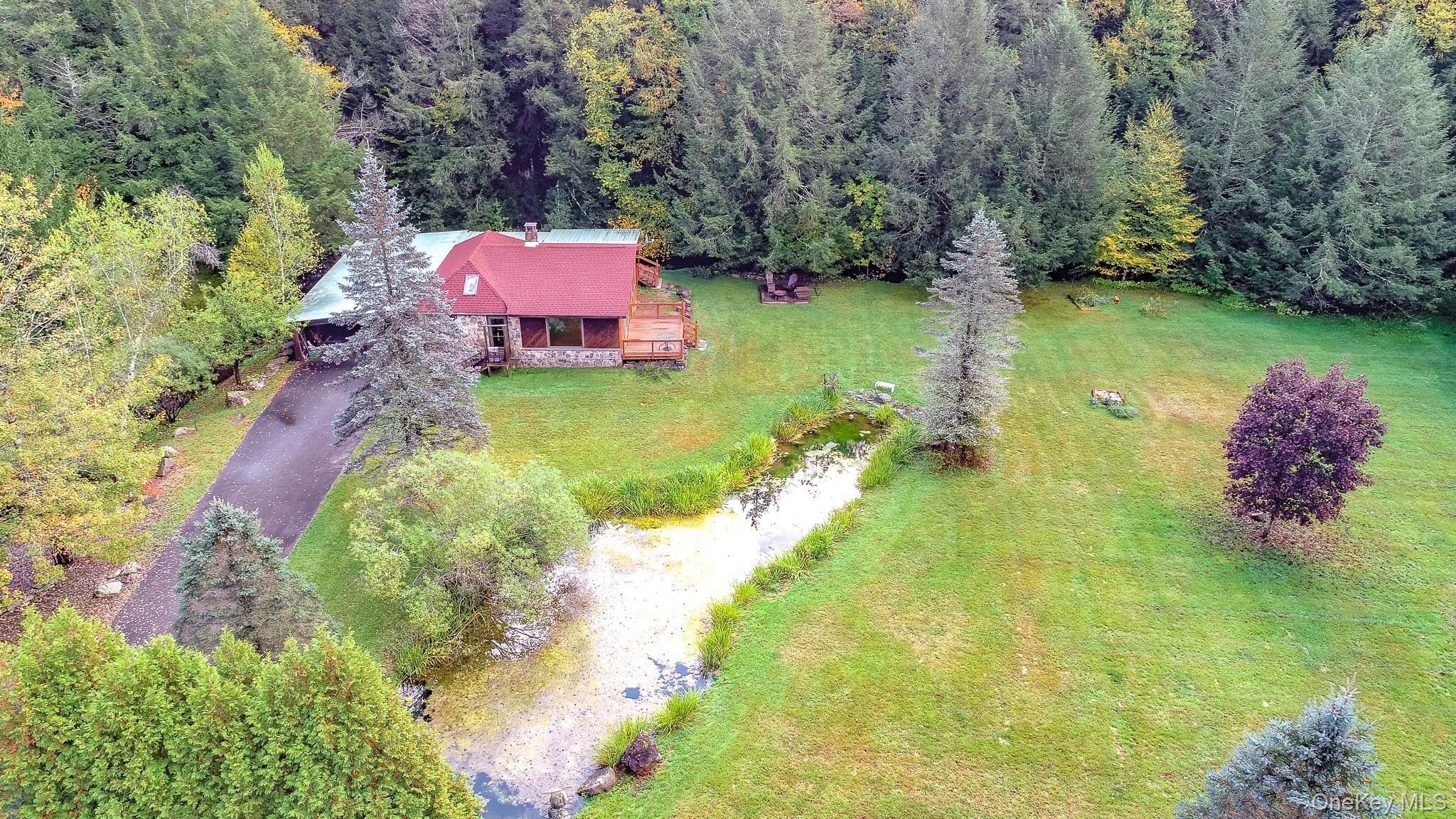 178 Aden Road Liberty, NY 12754 - Photo 11 of 27 a backyard of a house with lots of green space