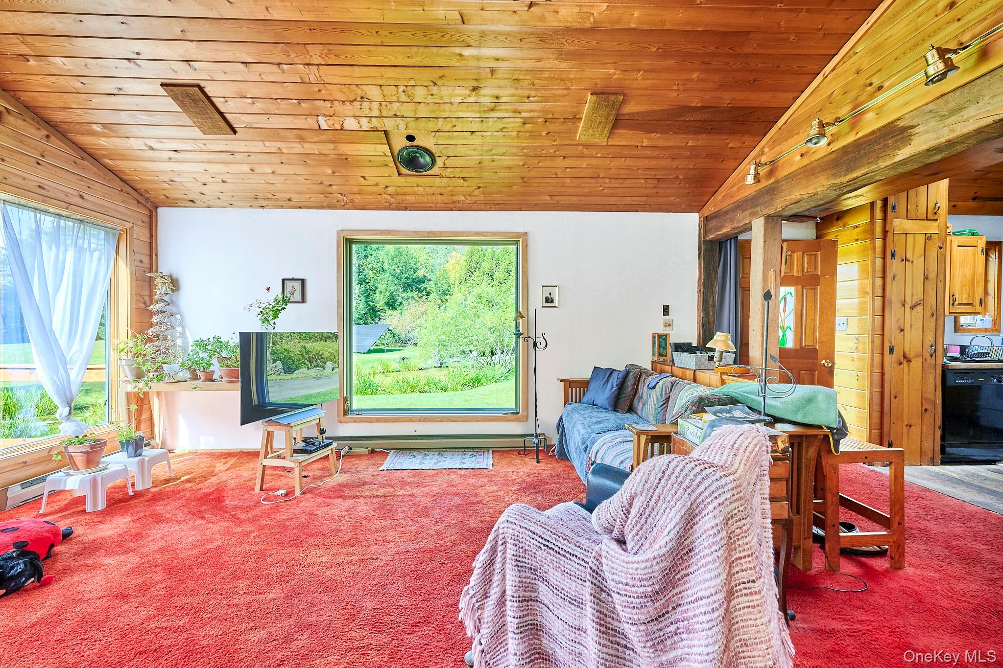 178 Aden Road Liberty, NY 12754 - Photo 16 of 27 a living room with furniture and a large window