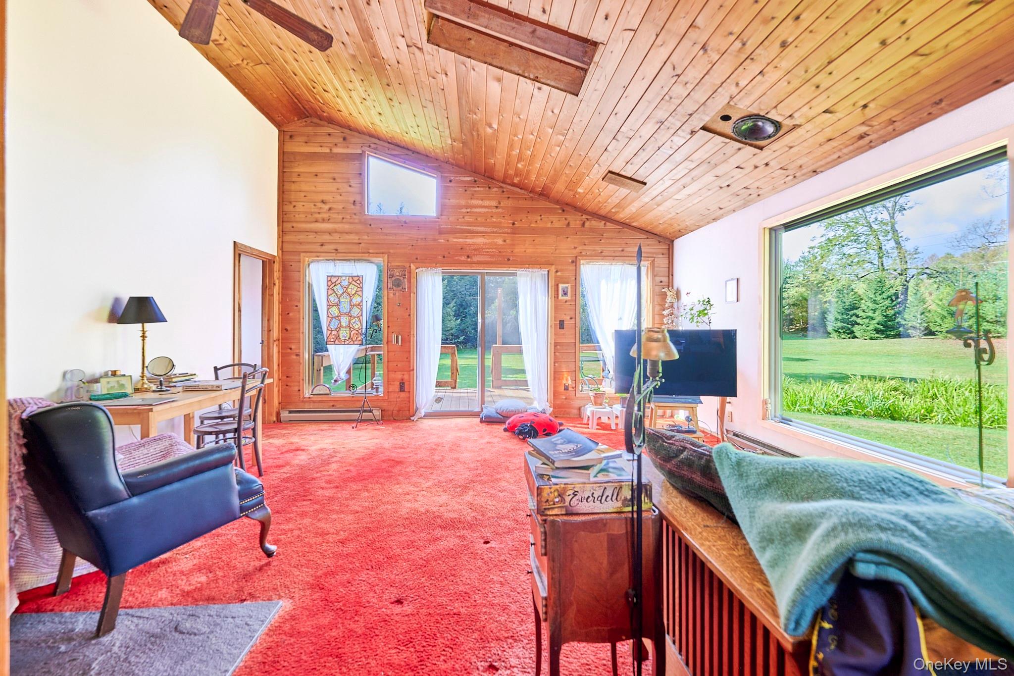 178 Aden Road Liberty, NY 12754 - Photo 17 of 27 a bedroom with furniture and large windows