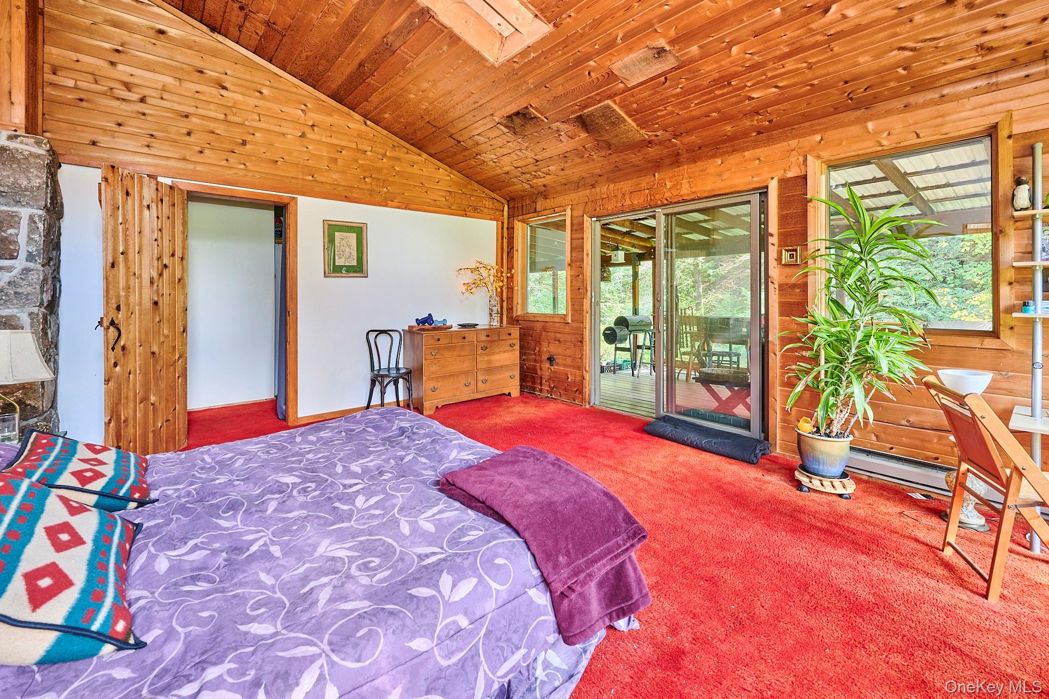 178 Aden Road Liberty, NY 12754 - Photo 19 of 27 a bedroom with a bed and large windows