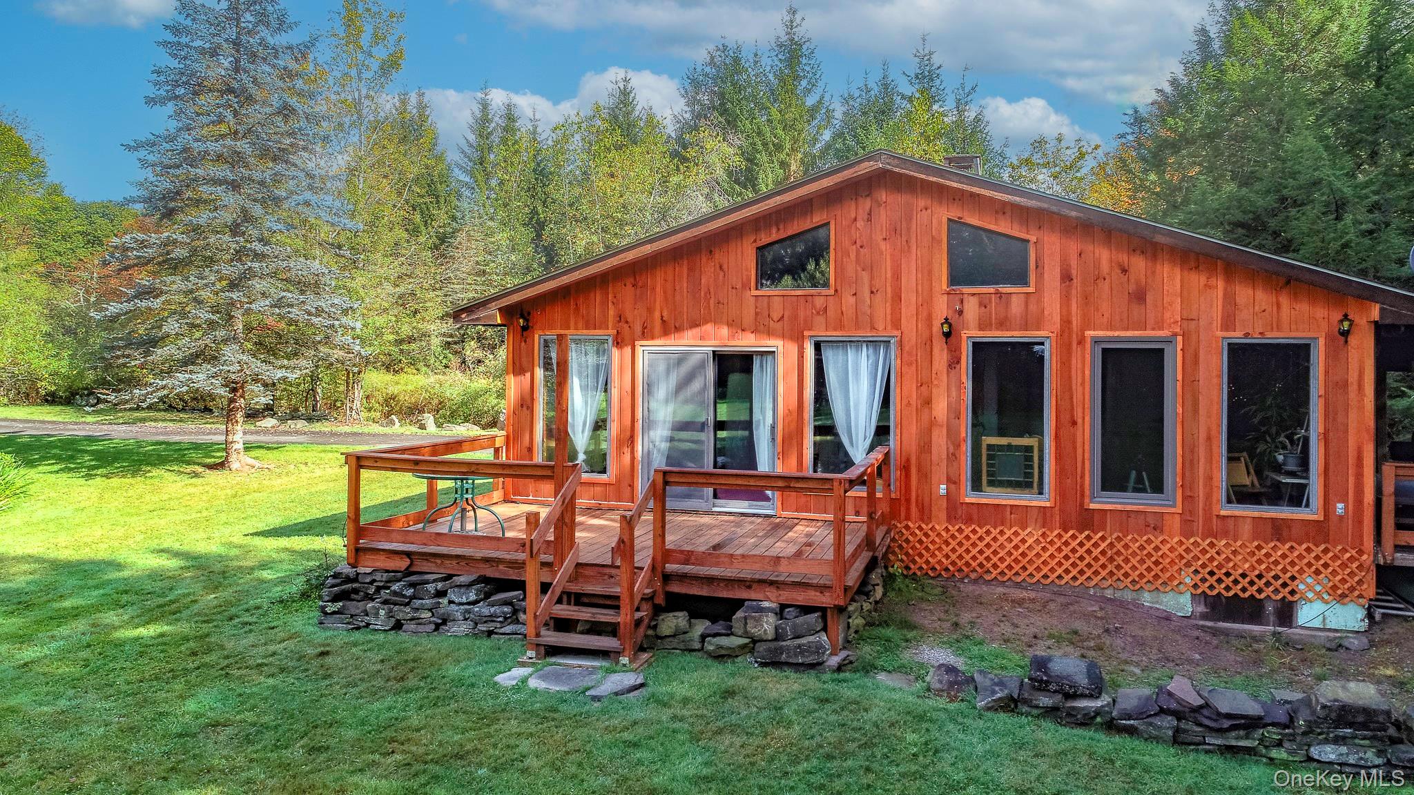 178 Aden Road Liberty, NY 12754 - Photo 3 of 27 a view of a house with a yard and sitting area