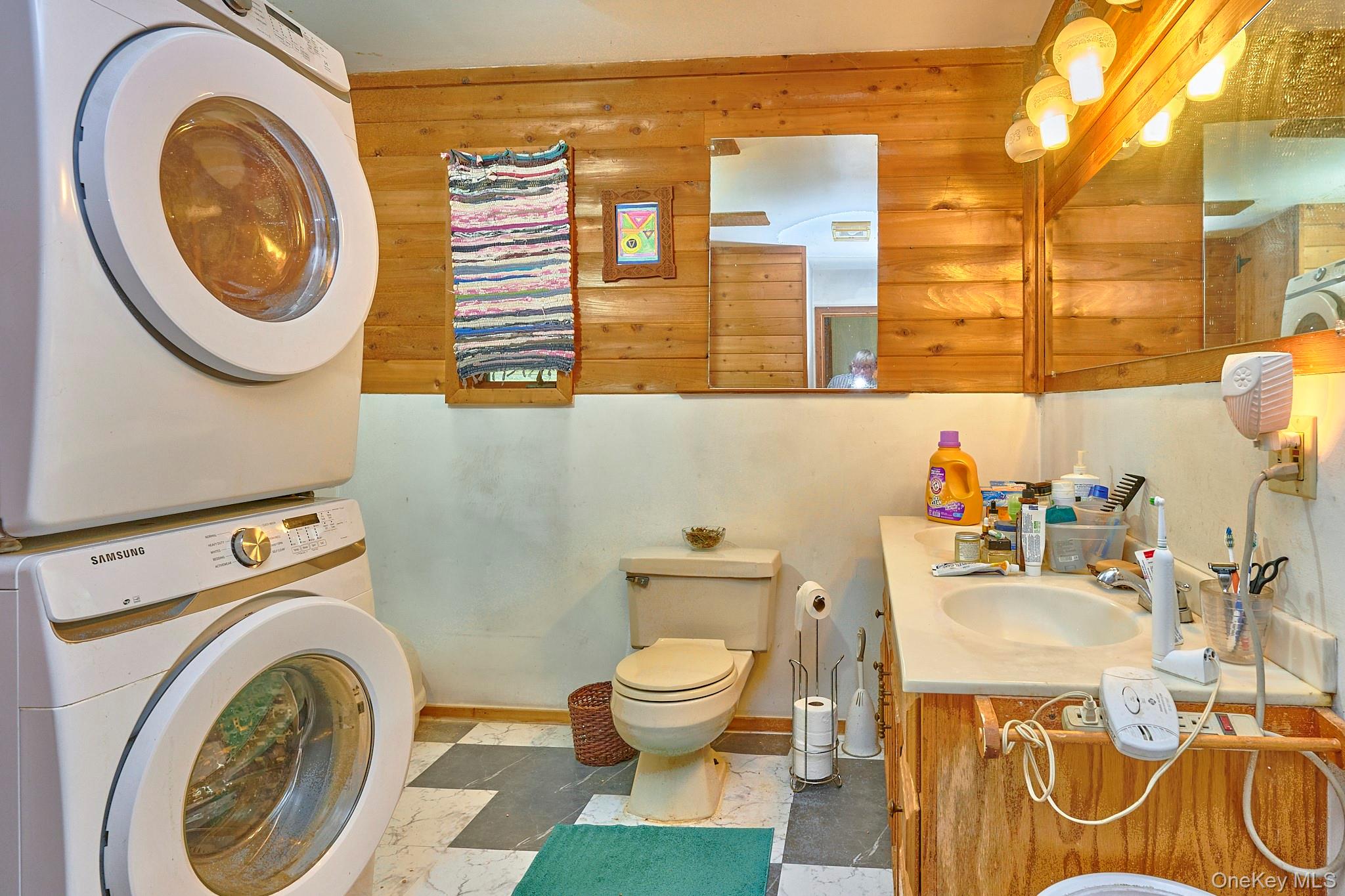 178 Aden Road Liberty, NY 12754 - Photo 10 of 27 a bathroom with a sink a washer and dryer