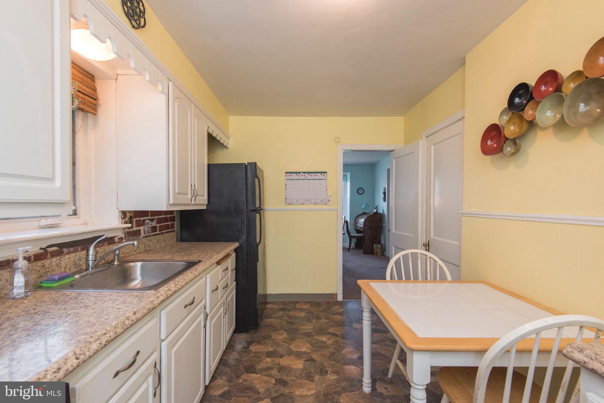 9 Fairfield Road Havertown, PA 19083 - Photo 17 of 31 a kitchen with a sink and a refrigerator