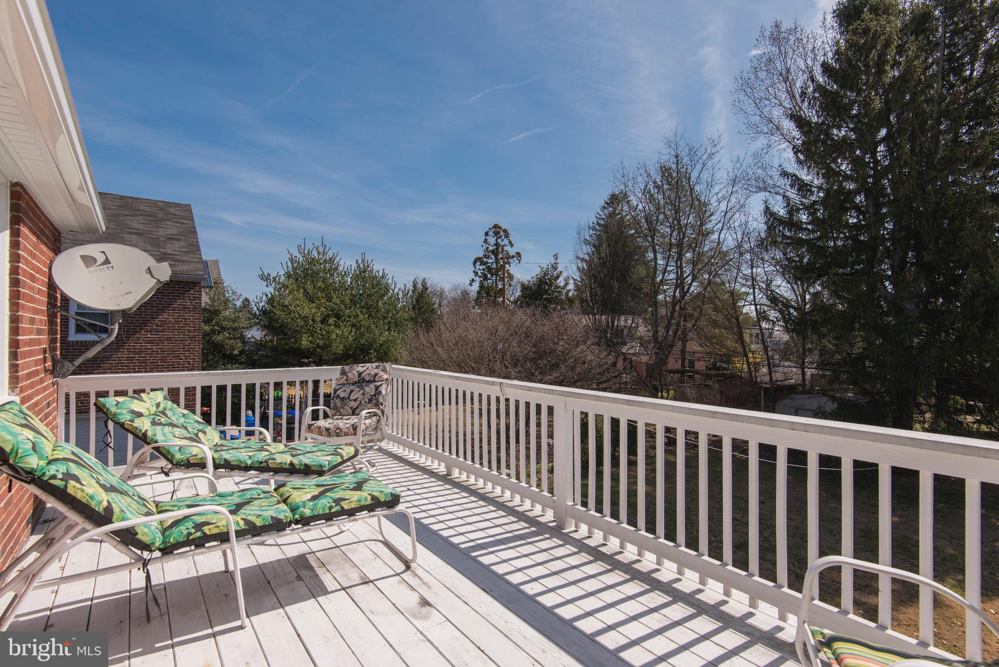 9 Fairfield Road Havertown, PA 19083 - Photo 24 of 31 a view of a wooden deck with a bench