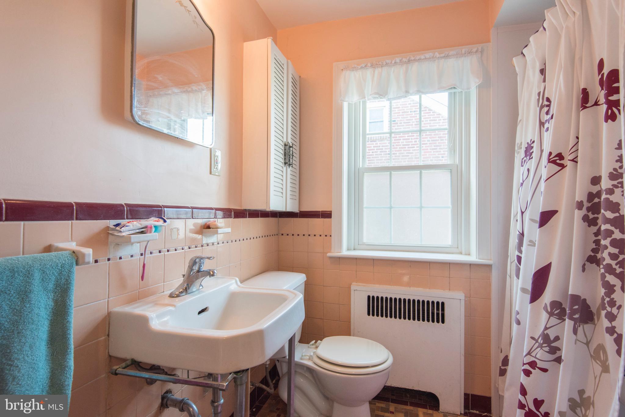 9 Fairfield Road Havertown, PA 19083 - Photo 28 of 31 a bathroom with a sink toilet and mirror