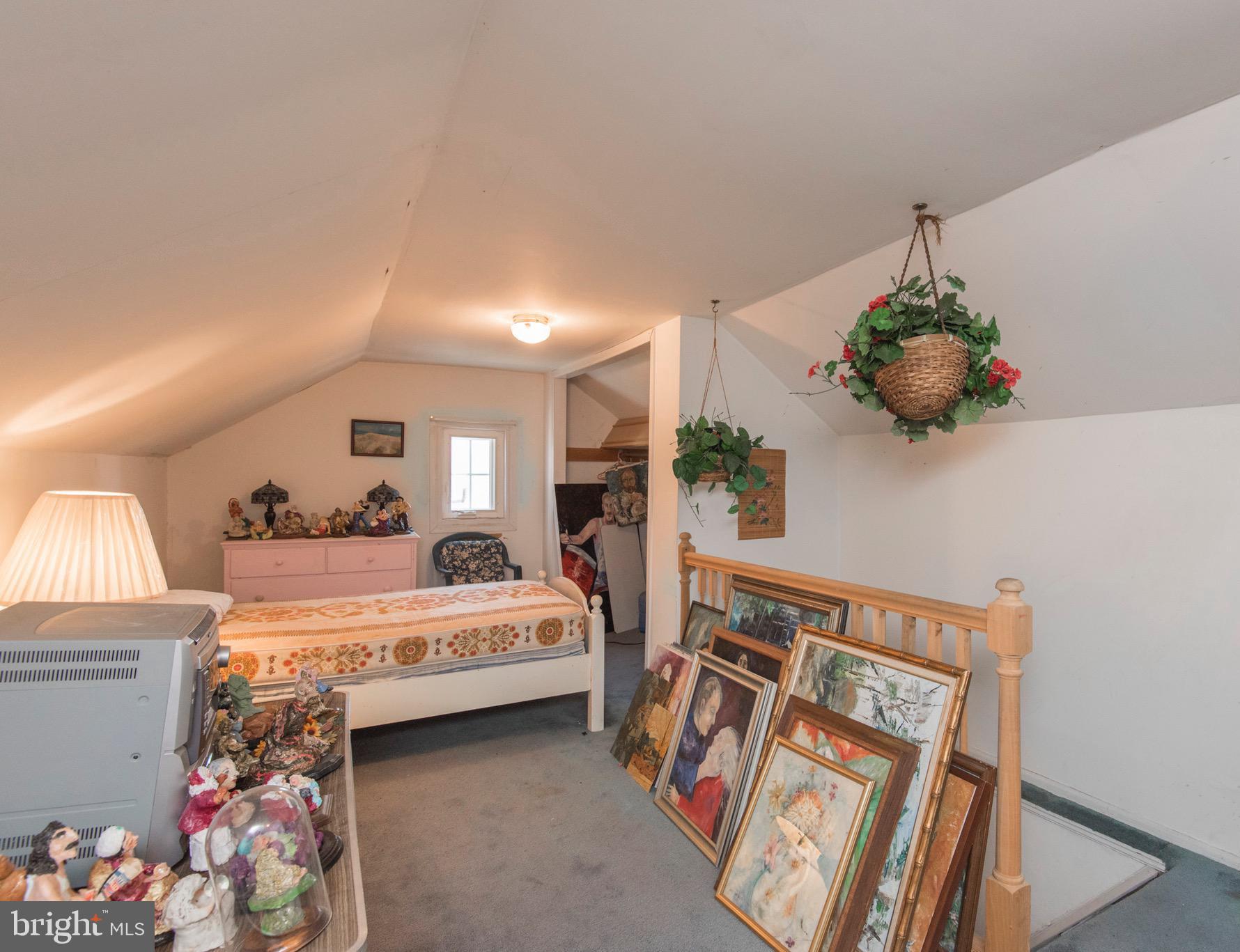 9 Fairfield Road Havertown, PA 19083 - Photo 30 of 31 a bedroom with a bed and a chandelier