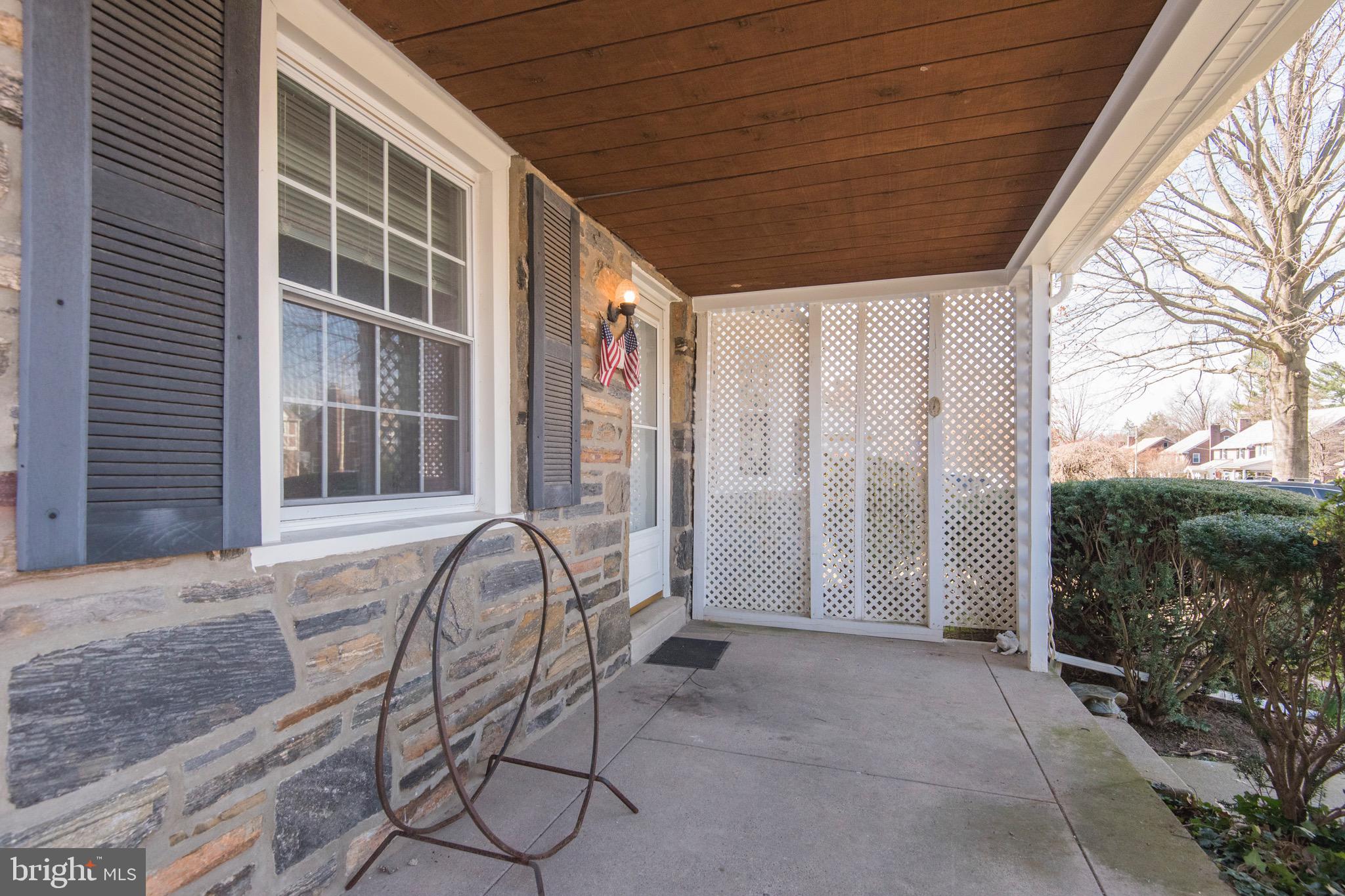 9 Fairfield Road Havertown, PA 19083 - Photo 9 of 31 a view of a porch with a table and chairs and potted plants